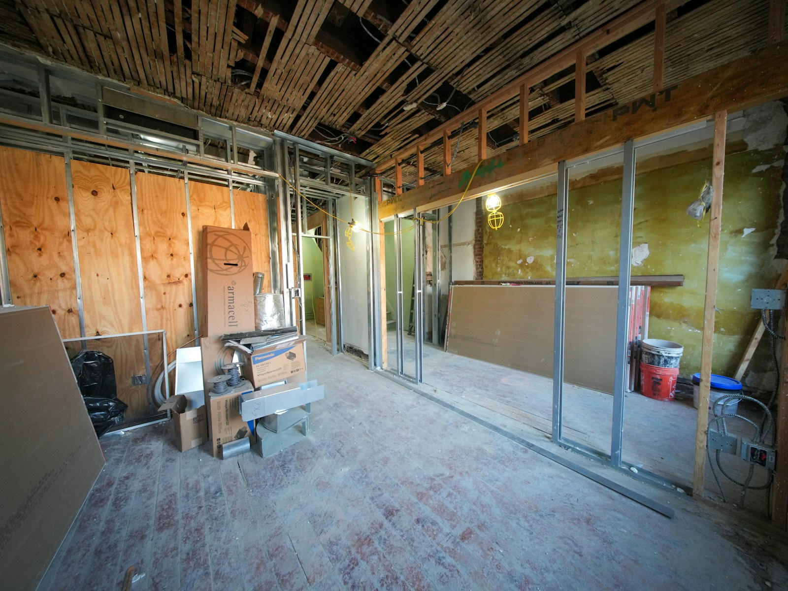 Interior renovation with exposed framing before finishing